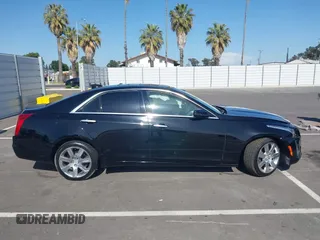 2016 Cadillac CTS Luxury Collection RWD z VIN 1G6AR5SS8G0156144, wystawiony jako IAAI lot #42087602 z przebiegiem Nie podano mil oraz . Historia ofert i sprzedaży dostępna na DreamBid. Obrazek 13.