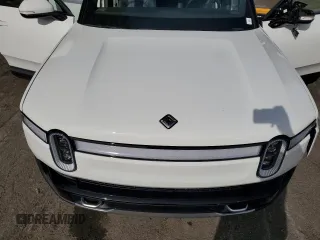 2024 Rivian R1S Adventure z VIN 7PDSGABAXRN035766, wystawiony jako Copart lot #77481034 z przebiegiem 6 590 mil mil oraz Szkoda całkowita • Salvage title. Historia ofert i sprzedaży dostępna na DreamBid. Obrazek 14.