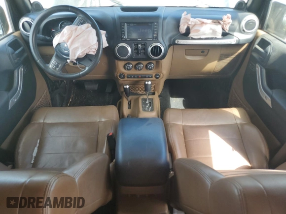 2012 Jeep Wrangler Unlimited Sahara with VIN 1C4HJWEG5CL205826, listed as a Copart auction lot 58222115 with 98,940 mi miles and Salvage title. Bid and sale history available at DreamBid. Image 8.