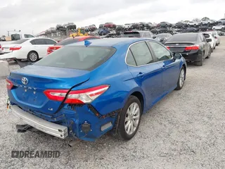 2020 Toyota Camry LE with VIN 4T1L11AK5LU310671, listed as a IAAI auction lot 41732306 with 61,379 mi miles and . Bid and sale history available at carsss.com. Image 4.