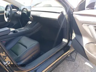 2021 Tesla Model 3 Long Range with VIN 5YJ3E1EB2MF065583, listed as a IAAI auction lot 42067399 with 52,333 mi miles. Bid and sale history available at carsss.com. Image 5.