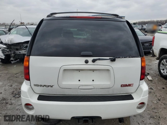2004 GMC Envoy SLT with VIN 1GKDT13SX42404837, listed as a Copart auction lot 84515994 with 184,153 mi miles and Salvage Title. Bid and sale history available at carsss.com. Image 6.