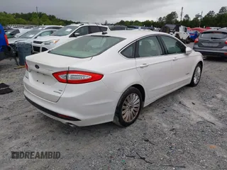 2014 Ford Fusion SE Hybrid with VIN 3FA6P0LU3ER312041, listed as a IAAI auction lot 41964588 with 138,566 mi miles and . Bid and sale history available at DreamBid. Image 4.