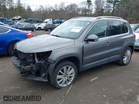 2011 Volkswagen Tiguan SE with VIN WVGBV7AX4BW532524, listed as a IAAI auction lot 41757552 with 141,115 mi miles and . Bid and sale history available at DreamBid. Image 2.