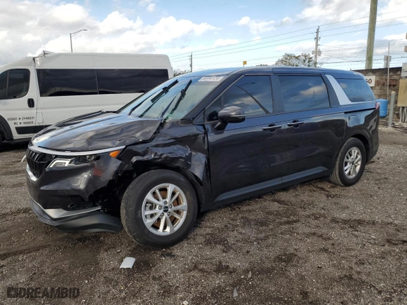 2023 Kia Carnival LX with VIN KNDNB4H38P6255833, listed as a Copart auction lot 86990124 with 6,818 mi miles and Salvage Title. Bid and sale history available at carsss.com. Image 1.