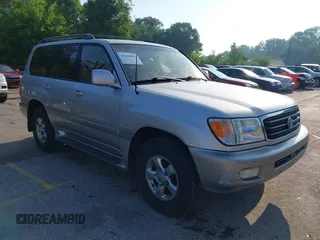 2001 Toyota Land Cruiser z VIN JTEHT05J912007249, wystawiony jako IAAI lot #42409963 z przebiegiem 303 292 mil mil oraz . Historia ofert i sprzedaży dostępna na DreamBid. Obrazek 1.