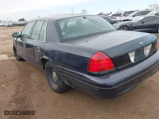 2001 Ford Crown Victoria Police Pkg Police Interceptor with VIN 2FAFP71W01X198332, listed as a IAAI auction lot 41474334 with 141,148 mi miles. Bid and sale history available at carsss.com. Image 3.