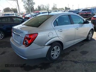 2013 Chevrolet Sonic LT with VIN 1G1JC5SB2D4243632, listed as a IAAI auction lot 42072421 with 40,289 mi miles and . Bid and sale history available at DreamBid. Image 4.