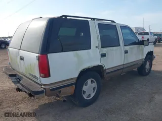 1997 Chevrolet Tahoe with VIN 1GNEK13R3VJ416827, listed as a IAAI auction lot 42041780 with 143,566 mi miles. Bid and sale history available at carsss.com. Image 4.