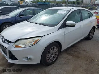 2012 Ford Focus SEL with VIN 1FAHP3H27CL387869, listed as a IAAI auction lot 41976528 with 106,927 mi miles. Bid and sale history available at carsss.com. Image 2.