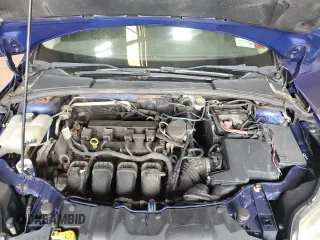 2012 Ford Focus SE z VIN 1FAHP3K23CL412887, wystawiony jako Copart lot #54366635 z przebiegiem 169 788 mil mil oraz Czysty tytuł • Clean title. Historia ofert i sprzedaży dostępna na DreamBid. Obrazek 11.