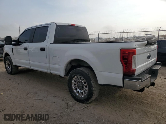 2019 Ford Super Duty F-250 SRW XL with VIN 1FT7W2A68KEE62694, listed as a Copart auction lot 82036854 with 153,678 mi miles and Salvage Title. Bid and sale history available at carsss.com. Image 2.