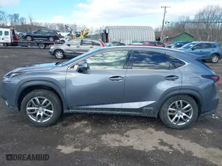 2015 Lexus NX 300h with VIN JTJBJRBZ1F2018555, listed as a IAAI auction lot 41528256 with 115,169 mi miles. Bid and sale history available at carsss.com. Image 14.