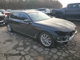2018 BMW 7 Series 740i with VIN WBA7E2C58JG743269, listed as a Copart auction lot 84905044 with 74,951 mi miles and Salvage Title. Bid and sale history available at carsss.com. Image 4.