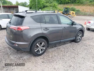 2016 Toyota RAV4 XLE with VIN 2T3RFREV4GW494108, listed as a IAAI auction lot 42234227 with 102,216 mi miles and . Bid and sale history available at DreamBid. Image 4.