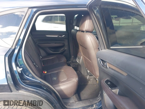 2019 Mazda CX-5 Signature with VIN JM3KFBEY5K0609063, listed as a IAAI auction lot 41802772 with 104,112 mi miles. Bid and sale history available at carsss.com. Image 8.