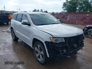 2016 Jeep Grand Cherokee Overland z VIN 1C4RJECG2GC423763, wystawiony jako IAAI lot #42108617 z przebiegiem 135 624 mil mil oraz . Historia ofert i sprzedaży dostępna na DreamBid. Obrazek 1.
