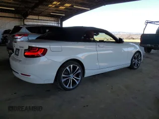2016 BMW 2 Series 228i with VIN WBA1K9C53GV710823, listed as a Copart auction lot 84087434 with 70,822 mi miles and Salvage Title. Bid and sale history available at carsss.com. Image 3.
