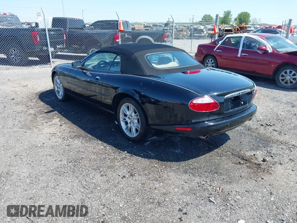 2002 Jaguar XK with VIN SAJDA42C12NA30499, listed as a IAAI auction lot 41954577 with 77,152 mi miles and . Bid and sale history available at DreamBid. Image 3.