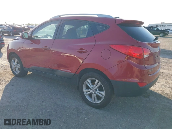 2013 Hyundai Tucson GLS with VIN KM8JU3AC6DU763590, listed as a IAAI auction lot 41999555 with 149,960 mi miles. Bid and sale history available at carsss.com. Image 3.