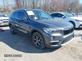 2018 BMW X1 xDrive28i z VIN WBXHT3C31J3H31737, wystawiony jako IAAI lot #41698670 z przebiegiem 68 017 mil mil oraz . Historia ofert i sprzedaży dostępna na DreamBid. Obrazek 1.