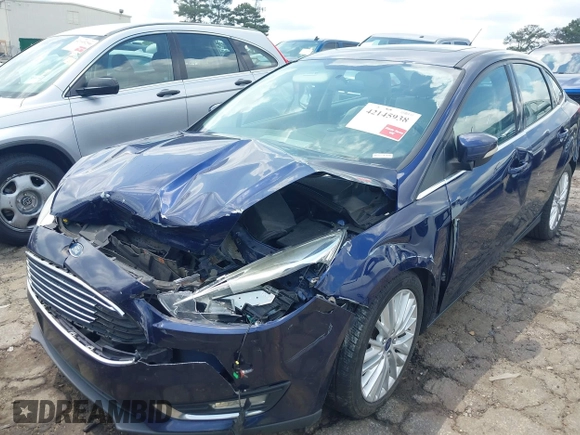 2016 Ford Focus Titanium z VIN 1FADP3J20GL208439, wystawiony jako IAAI lot #42145938 z przebiegiem 135 522 mil mil oraz . Historia ofert i sprzedaży dostępna na DreamBid. Obrazek 6.