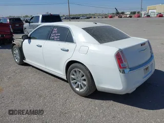2014 Chrysler 300 with VIN 2C3CCAEG4EH312930, listed as a IAAI auction lot 41907509 with 128,940 mi miles. Bid and sale history available at carsss.com. Image 3.
