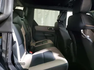 2024 Ford Bronco Wildtrak z VIN 1FMEE2BP1RLA76928, wystawiony jako Copart lot #46423395 z przebiegiem 4873 mil mil oraz Szkody całkowita. Historia ofert i sprzedaży dostępna na DreamBid. Obrazek 11.
