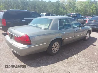 2003 Mercury Grand Marquis LS Premium z VIN 2MEFM75W53X691700, wystawiony jako IAAI lot #41952048 z przebiegiem 208 747 mil mil oraz . Historia ofert i sprzedaży dostępna na DreamBid. Obrazek 4.