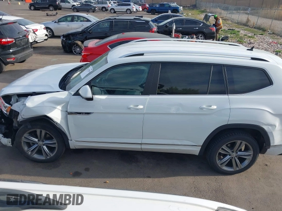 2018 Volkswagen Atlas SE z VIN 1V2FR2CA2JC540657, wystawiony jako IAAI lot #42115554 z przebiegiem 107 309 mil mil oraz . Historia ofert i sprzedaży dostępna na DreamBid. Obrazek 14.