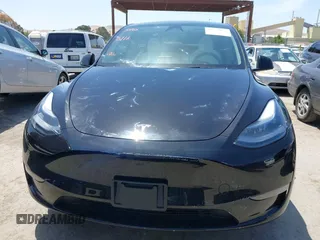 2024 Tesla Model Y with VIN 7SAYGDED9RF191453, listed as a IAAI auction lot 42272051 with 7,805 mi miles and . Bid and sale history available at DreamBid. Image 13.