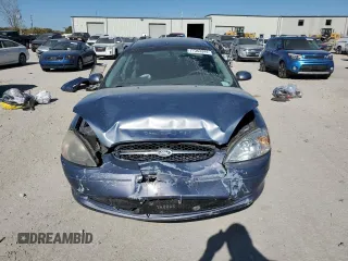 2000 Ford Taurus SE with VIN 1FAFP53U3YG259124, listed as a Copart auction lot 77363344 with 154,889 mi miles and Salvage Title. Bid and sale history available at DreamBid. Image 5.