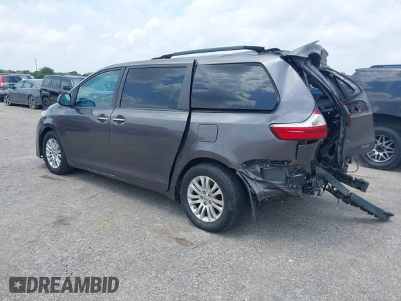 2015 Toyota Sienna XLE with VIN 5TDYK3DCXFS688971, listed as a IAAI auction lot 42127912 with 143,024 mi miles. Bid and sale history available at carsss.com. Image 3.