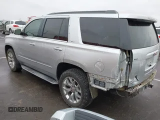 2015 GMC Yukon SLT with VIN 1GKS2BKCXFR131919, listed as a IAAI auction lot 41664827 with 149,398 mi miles. Bid and sale history available at carsss.com. Image 3.