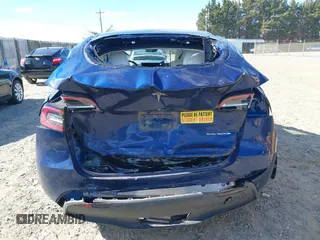 2023 Tesla Model Y Long Range with VIN 7SAYGDEE3PF674457, listed as a IAAI auction lot 41822138 with 43,901 mi miles. Bid and sale history available at carsss.com. Image 15.