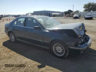 2000 BMW 5 Series 528iA with VIN WBADM6345YGU18707, listed as a Copart auction lot 63293814 with 0 mi miles and Salvage Title. Bid and sale history available at carsss.com. Image 4.