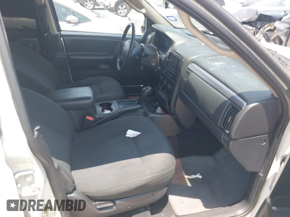 2003 Jeep Grand Cherokee Laredo with VIN 1J4GX48S63C546208, listed as a IAAI auction lot 42288811 with 141,696 mi miles and . Bid and sale history available at DreamBid. Image 5.