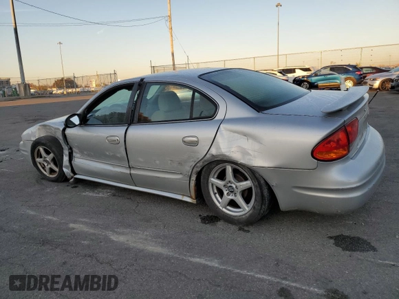 2003 Oldsmobile Alero GL1 z VIN 1G3NL52F13C182905, wystawiony jako Copart lot #77264384 z przebiegiem Nie podano mil oraz Szkoda całkowita • Salvage title. Historia ofert i sprzedaży dostępna na DreamBid. Obrazek 2.