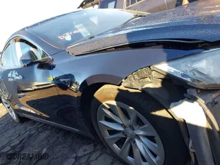 2014 Tesla Model S 60 kWh Battery with VIN 5YJSA1S11EFP32325, listed as a IAAI auction lot 40823219 with 47,911 mi miles. Bid and sale history available at carsss.com. Image 12.