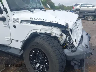 2016 Jeep Wrangler Unlimited Rubicon Hard Rock with VIN 1C4BJWFG3GL228449, listed as a IAAI auction lot 42158318 with Not provided miles and . Bid and sale history available at DreamBid. Image 14.