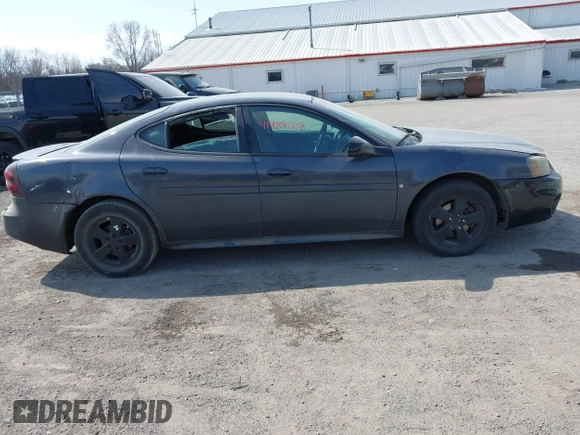 2008 Pontiac Grand Prix z VIN 2G2WP552281113384, wystawiony jako IAAI lot #41989008 z przebiegiem 242 354 mil mil oraz . Historia ofert i sprzedaży dostępna na DreamBid. Obrazek 13.