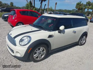 2013 MINI Cooper Clubman with VIN WMWZF3C57DT571338, listed as a IAAI auction lot 41367674 with 77,628 mi miles. Bid and sale history available at carsss.com. Image 2.