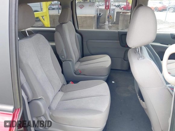 2012 Kia Sedona LX with VIN KNDMG4C71C6493153, listed as a IAAI auction lot 42176426 with 122,375 mi miles. Bid and sale history available at carsss.com. Image 8.