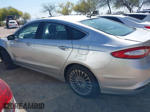 2014 Ford Fusion Titanium Hybrid with VIN 3FA6P0RUXER103516, listed as a IAAI auction lot 42004602 with 128,287 mi miles and . Bid and sale history available at carsss.com. Image 14.