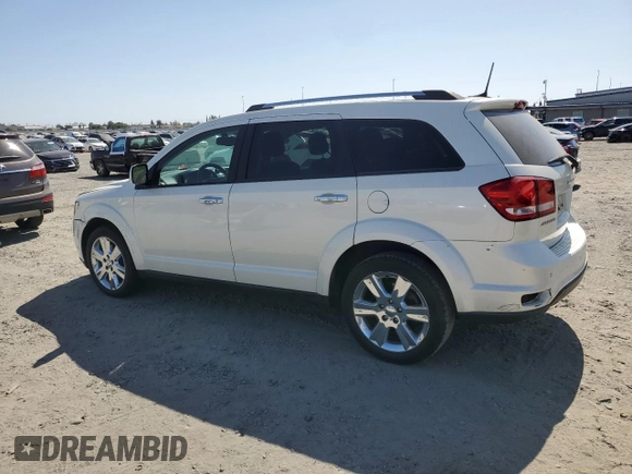 2013 Dodge Journey Crew with VIN 3C4PDCDG5DT668803, listed as a Copart auction lot 61931035 with 121,173 mi miles and Salvage title. Bid and sale history available at DreamBid. Image 2.