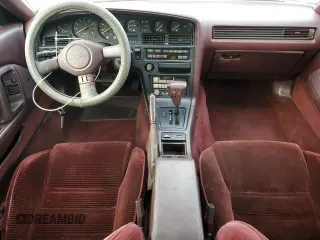 1988 Toyota Supra z VIN JT2MA71J0J0088041, wystawiony jako Copart lot #84402804 z przebiegiem 195 921 mil mil oraz Czysty tytuł • Clean title. Historia ofert i sprzedaży dostępna na DreamBid. Obrazek 8.
