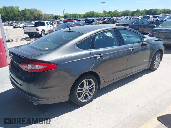 2016 Ford Fusion SE Hybrid with VIN 3FA6P0LU3GR127121, listed as a IAAI auction lot 41840795 with 88,281 mi miles. Bid and sale history available at carsss.com. Image 4.
