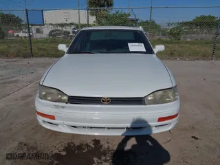 1993 Toyota Camry LE with VIN 4T1SK12E6PU316163, listed as a IAAI auction lot 42046444 with 261,514 mi miles. Bid and sale history available at carsss.com. Image 6.