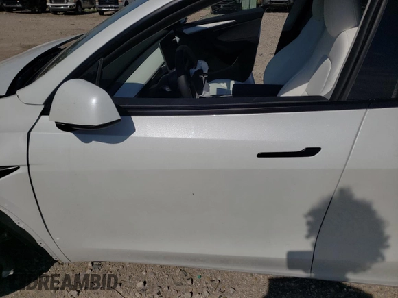 2023 Tesla Model Y Long Range with VIN 7SAYGDEE6PF861451, listed as a Copart auction lot 53133854 with 7,216 mi miles and Salvage Title. Bid and sale history available at DreamBid. Image 7.