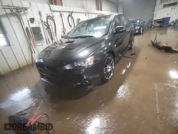 2013 Mitsubishi Lancer Evolution MR z VIN JA32W5FV5DU016540, wystawiony jako Copart lot #47615845 z przebiegiem 79 599 mil mil oraz Szkoda całkowita • Salvage title. Historia ofert i sprzedaży dostępna na DreamBid. Obrazek 14.
